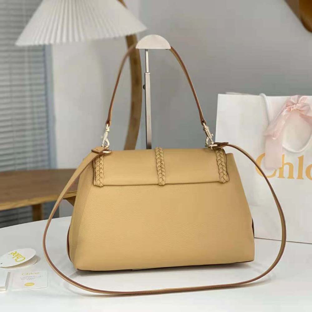 Side angle highlighting soft silhouette and leather texture of Chloe Women Penelope Medium Soft Shoulder Bag-Gold