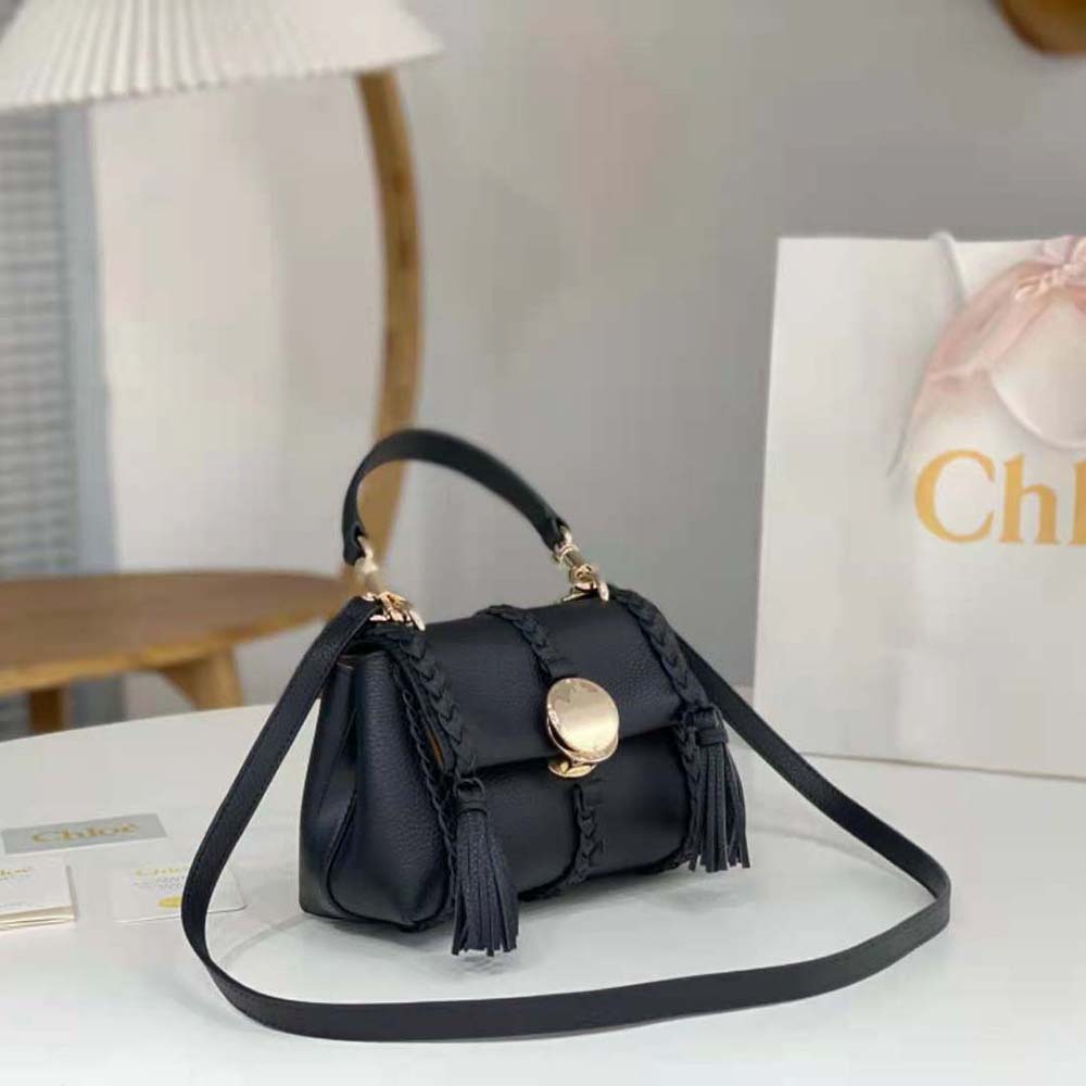 Side profile showing silhouette of Chloe Women Penelope Mini Soft Shoulder Bag-Black