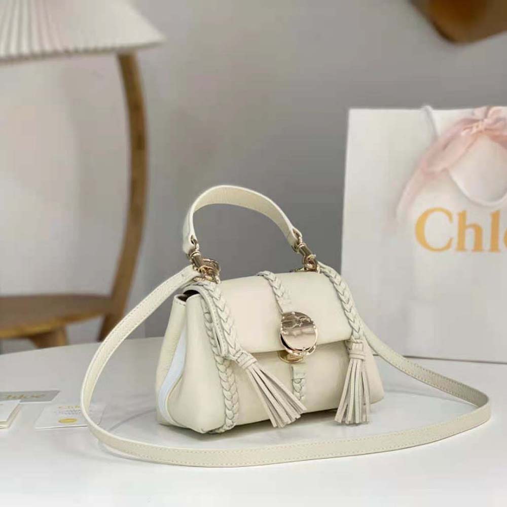 Side angle highlighting soft leather silhouette of Chloe Women Penelope Mini Soft Shoulder Bag-White