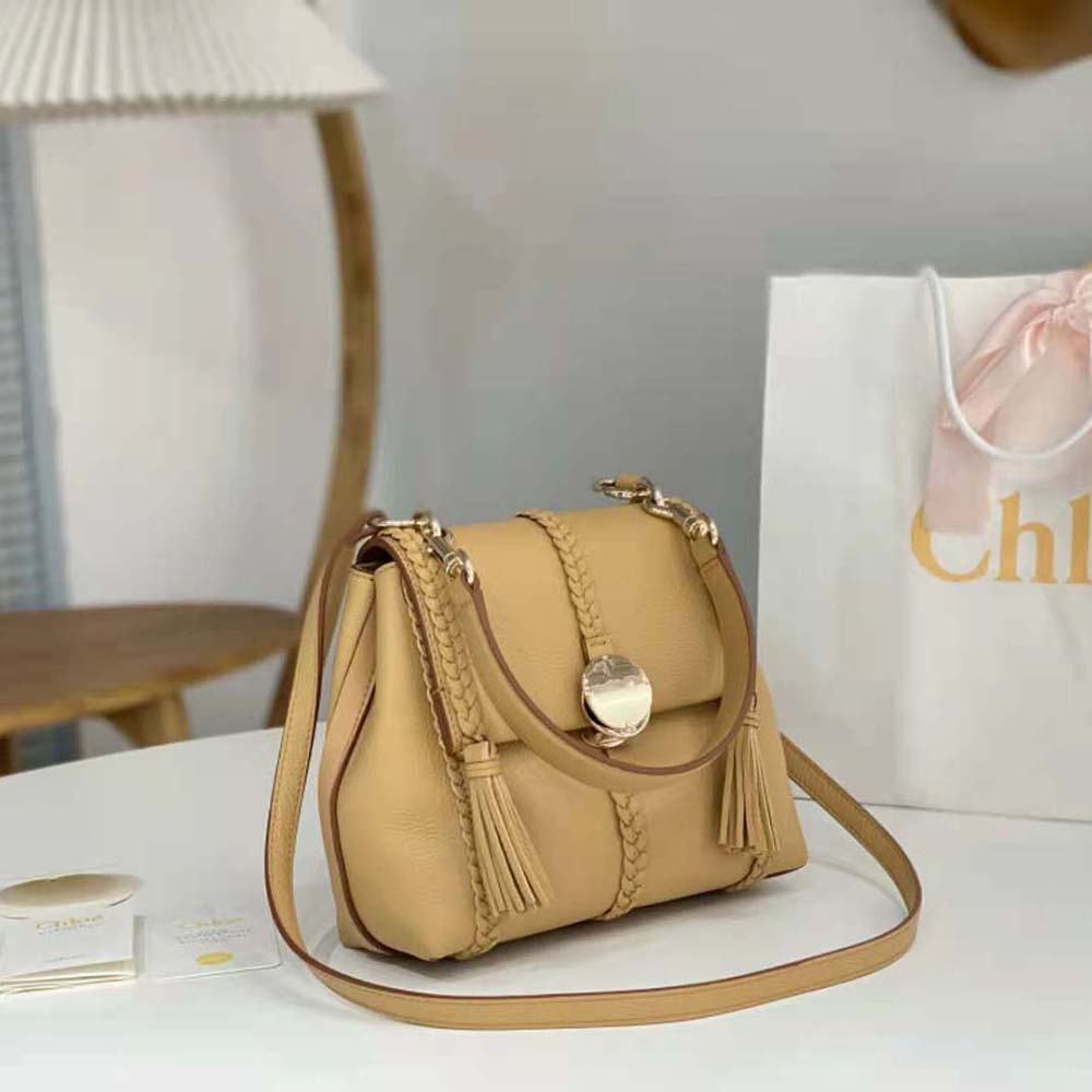 Side view highlighting smooth sandy leather texture of Chloe Women Penelope Small Soft Shoulder Bag-Sandy