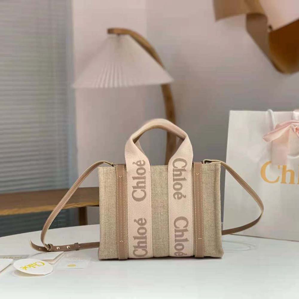 Close-up detail of gold hardware on Chloe Women Small Woody Tote Bag-Beige