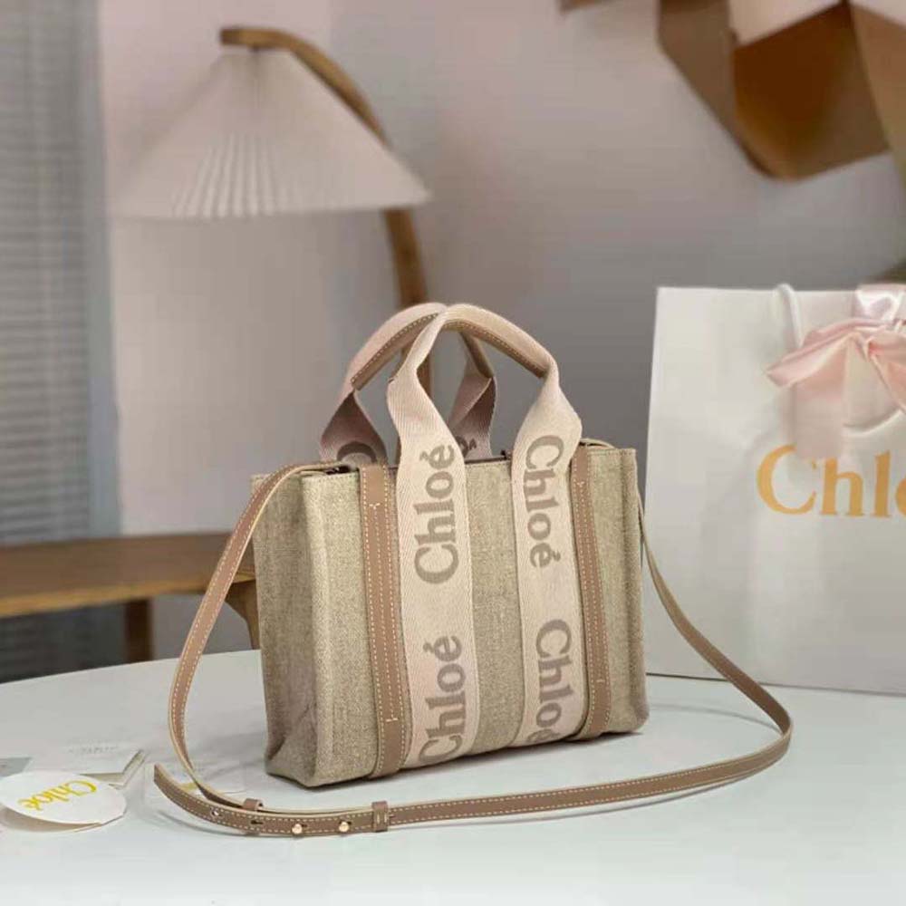 Side angle showing silhouette and beige leather texture of Chloe Women Small Woody Tote Bag-Beige