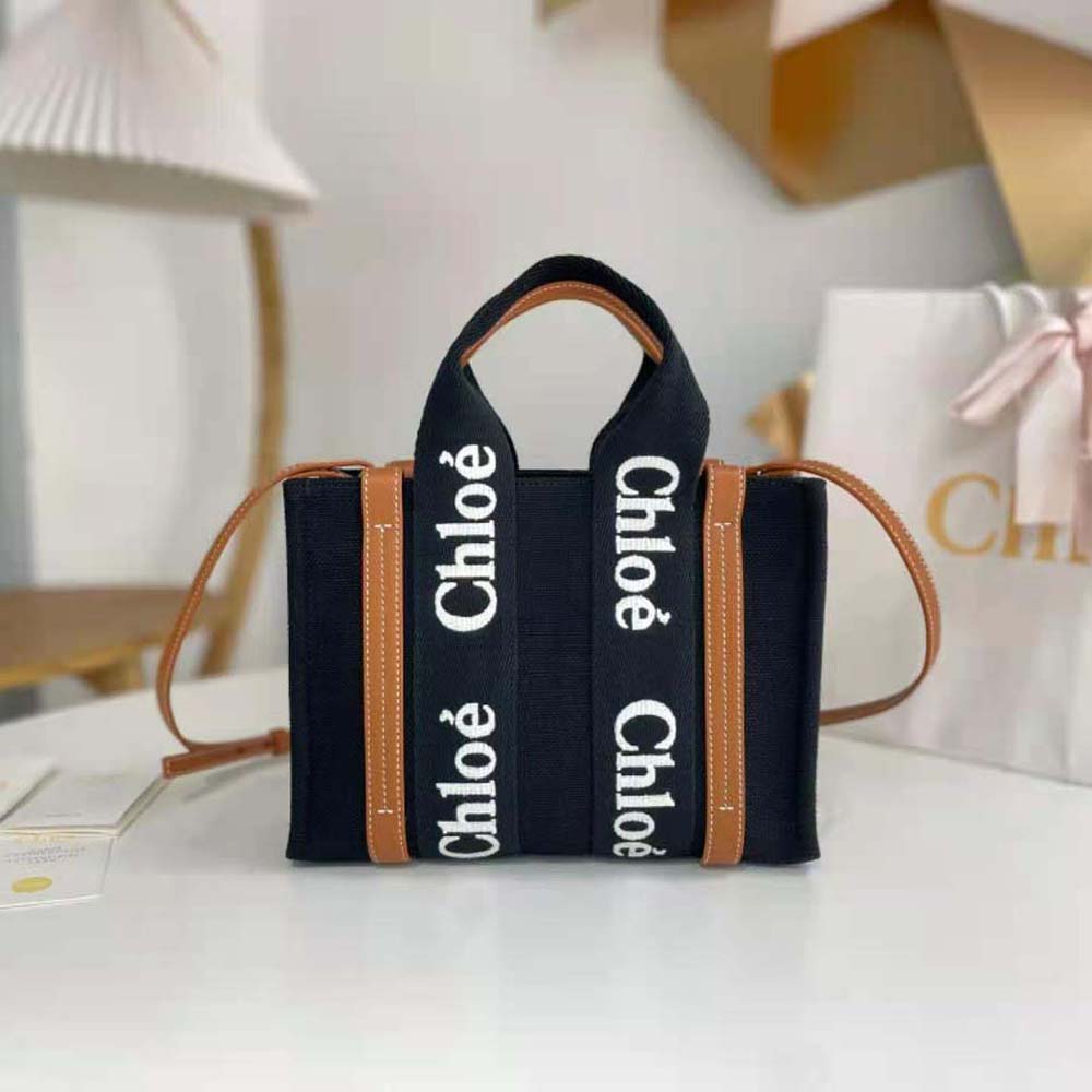 Close-up detail of gold-tone hardware on Chloe Women Small Woody Tote Bag-Black