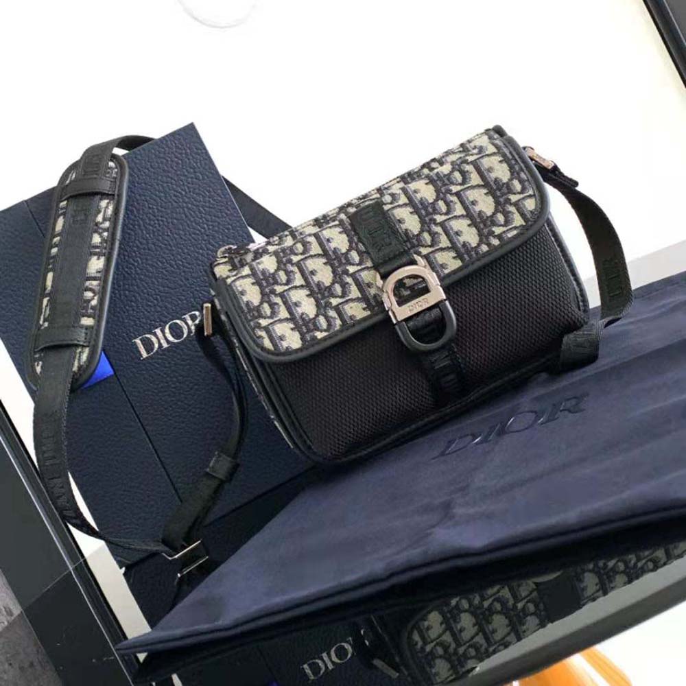 Close-up of silver hardware and jacquard texture Dior Men 8 Mini Bag strap detail