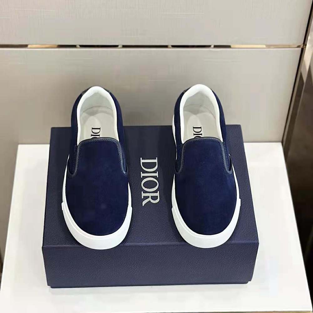 Side view showing signature embossed leather tab on Dior Men B101 Sneaker