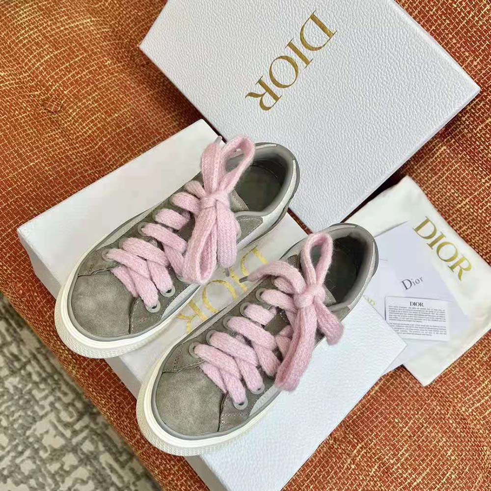 Close-up detail of gray suede and Dior Oblique jacquard on sneaker