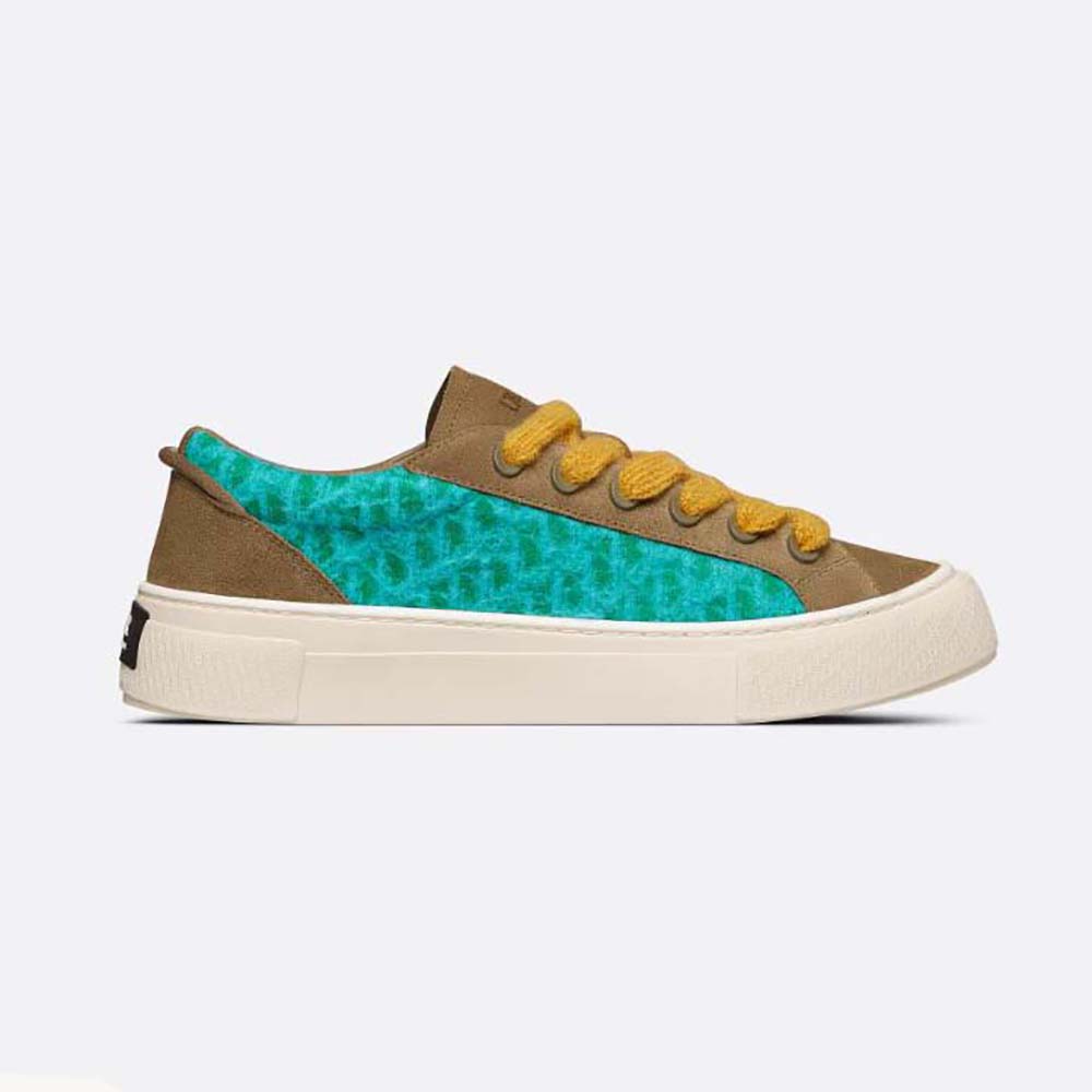 Side angle of Dior Men B33 Sneaker green leather and embossed details