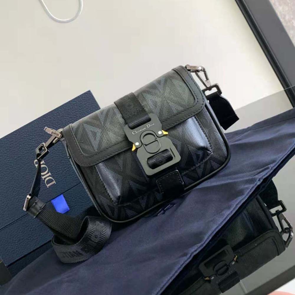 Close-up of silver-tone hardware and closure on Dior Men Mini Dior Hit the Road Bag