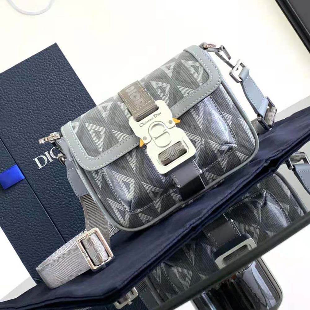 Close-up of silver hardware on Dior Men Mini Dior Hit the Road Bag