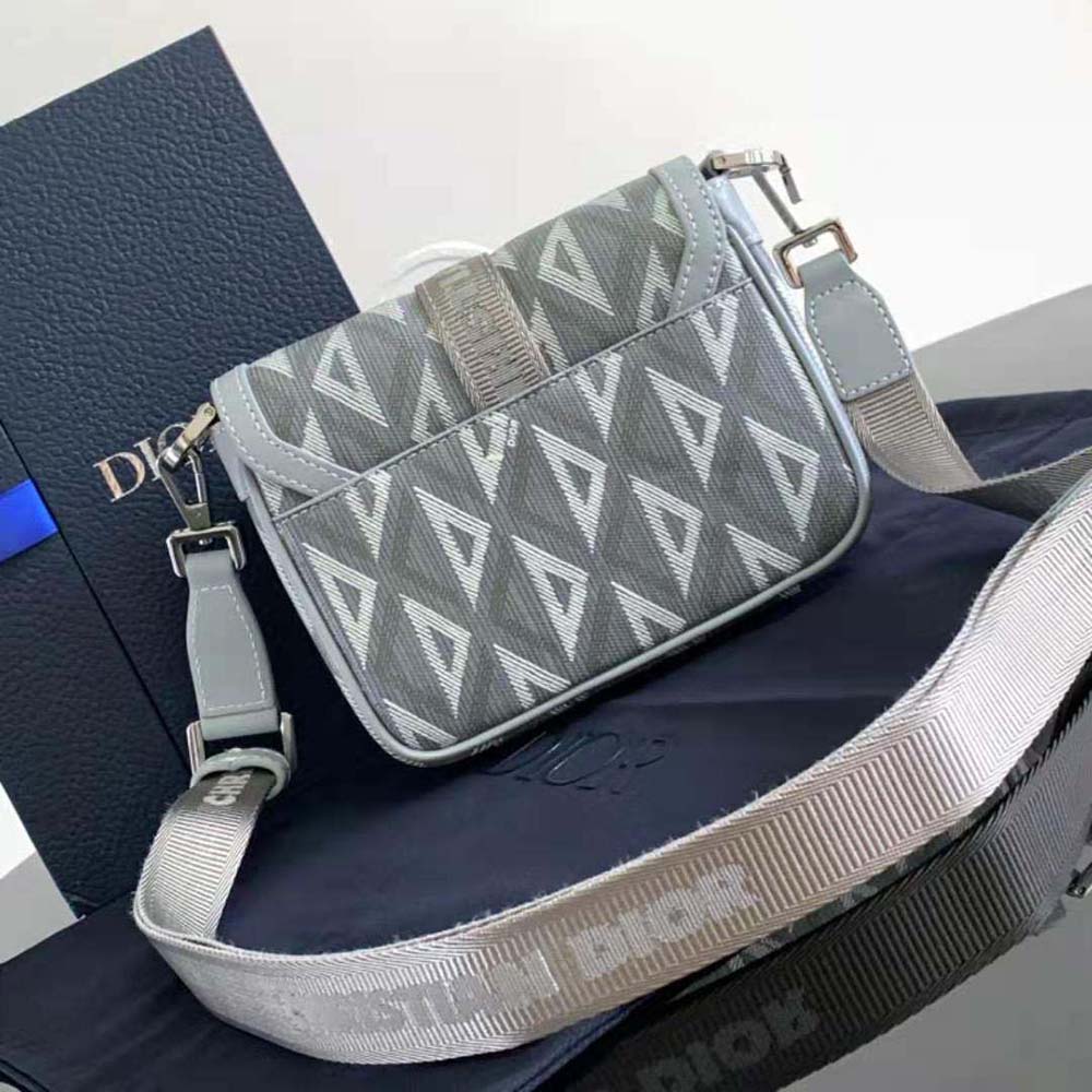 Side profile showing adjustable strap of Dior Men Mini Dior Hit the Road Bag