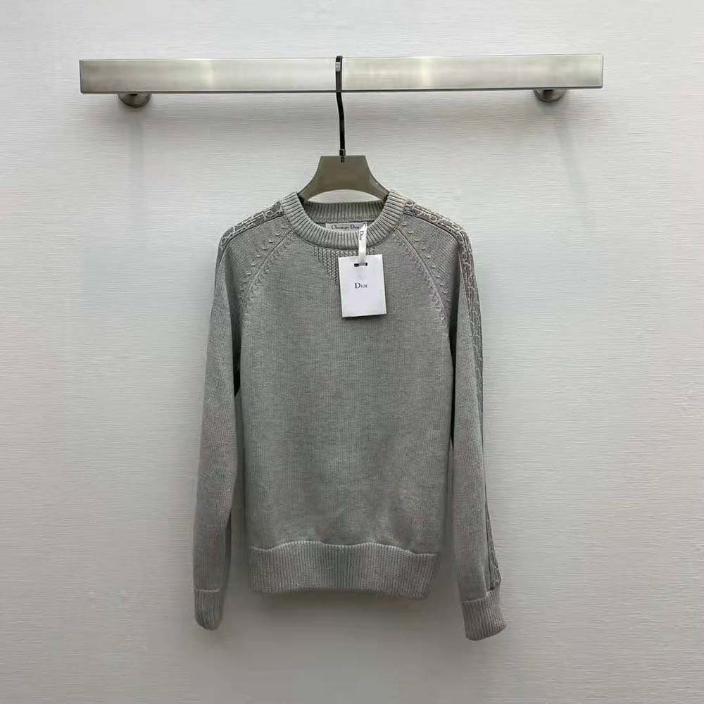 Close-up on Dior oblique inserts detail on gray cotton jersey sweater