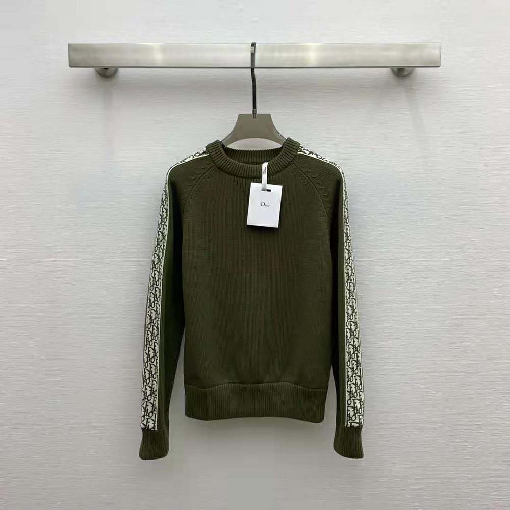 Close-up of Dior Oblique embroidery on khaki cotton jersey sweater