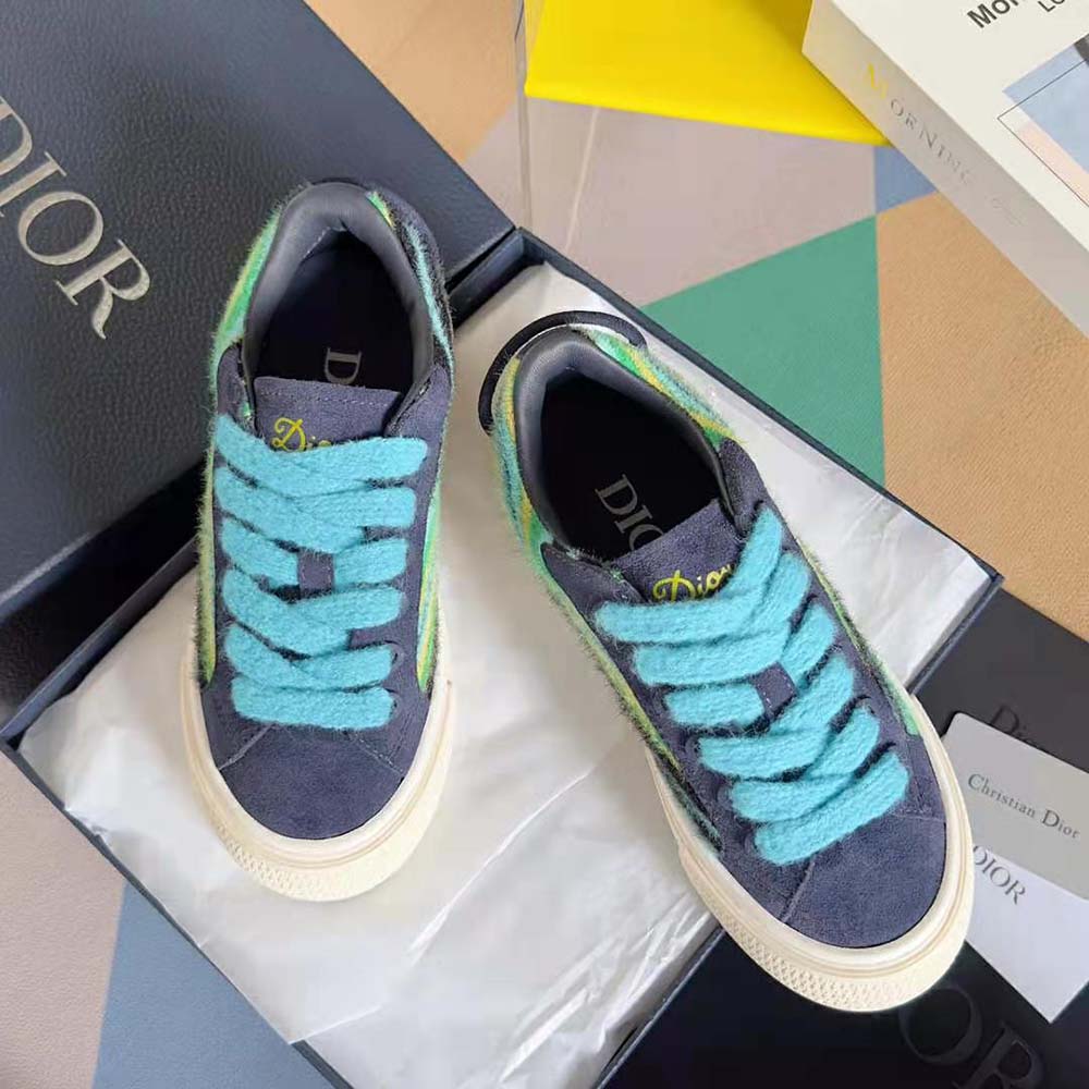 Overhead detail showing lace-up and leather texture on Dior Men Tears B33 Sneaker