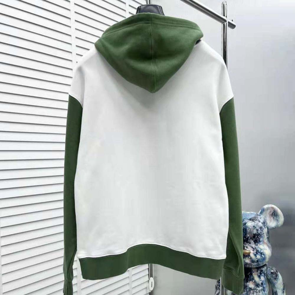 Side angle showing oversized fit of Dior Men Tears Oversized Hooded Sweatshirt