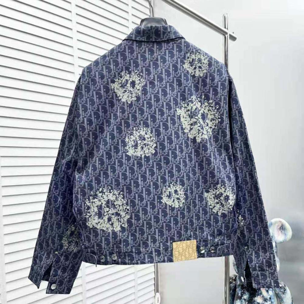 Side angle showing tailored fit of Dior Men Tears Zipped Blouson in blue denim