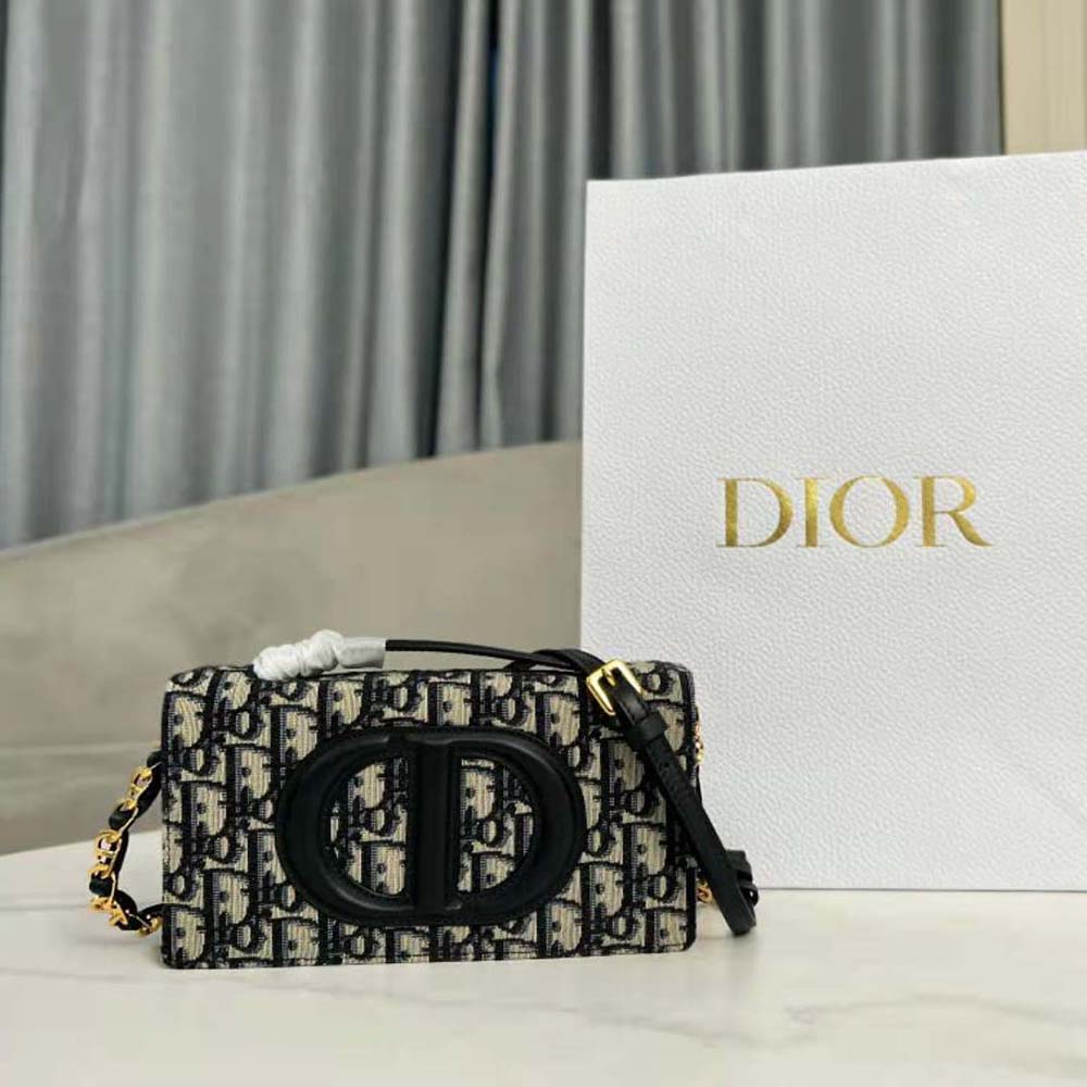 Close-up of silver CD hardware on Dior Women CD Signature Mini Bag