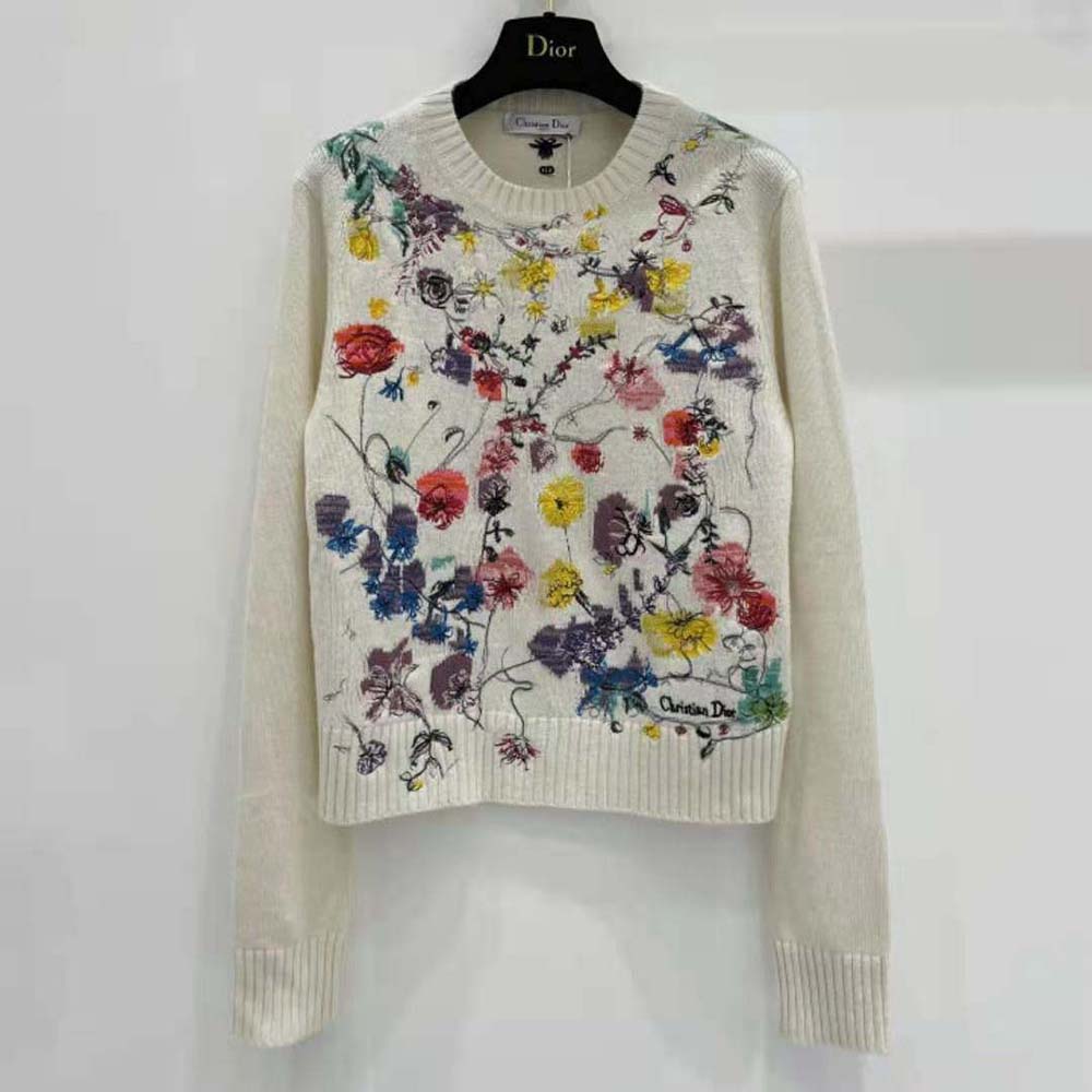 Close-up of red multicolor Florilegio embroidery on Dior white cashmere sweater