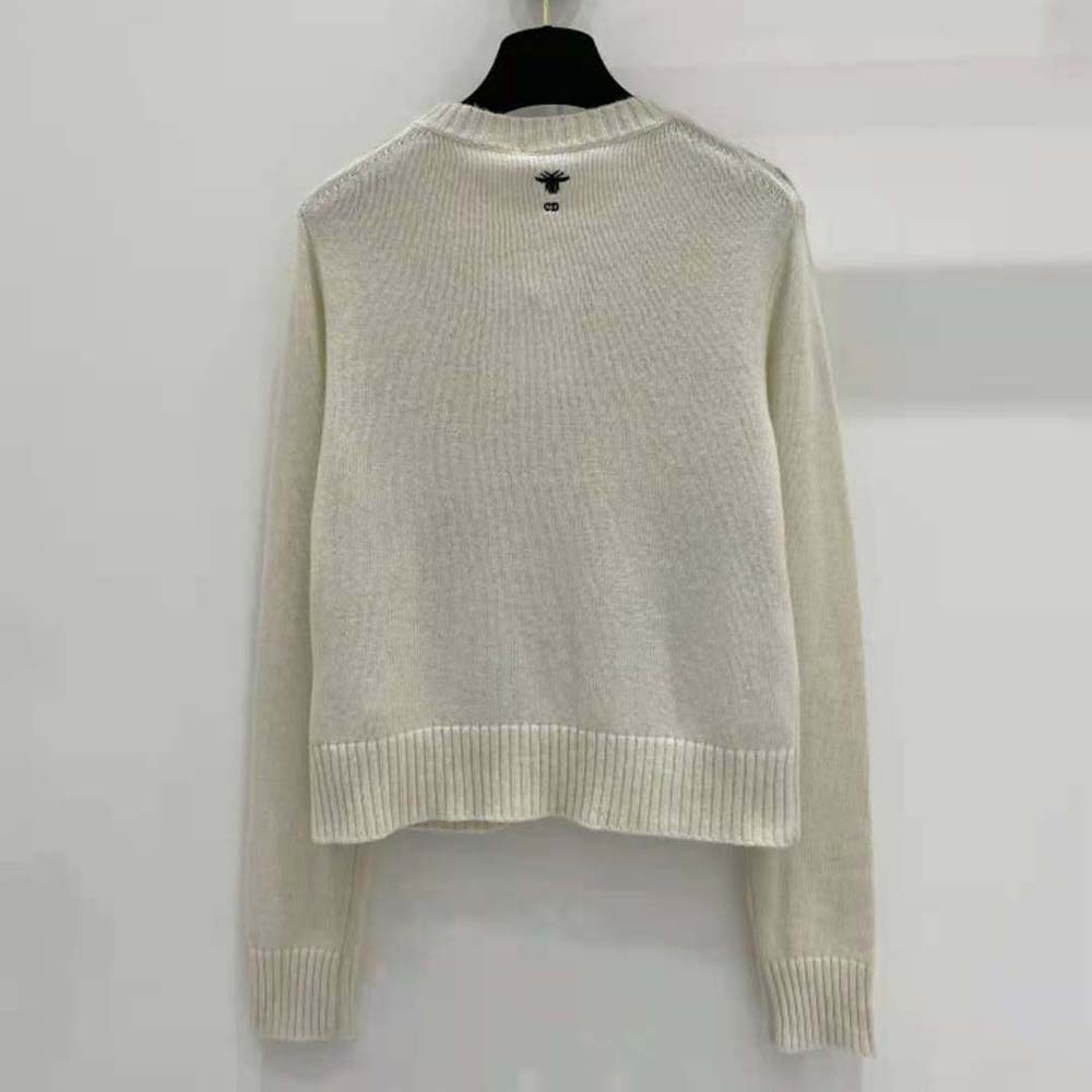 Side angle showing ribbed cuffs and silhouette of Dior Women Embroidered Sweater