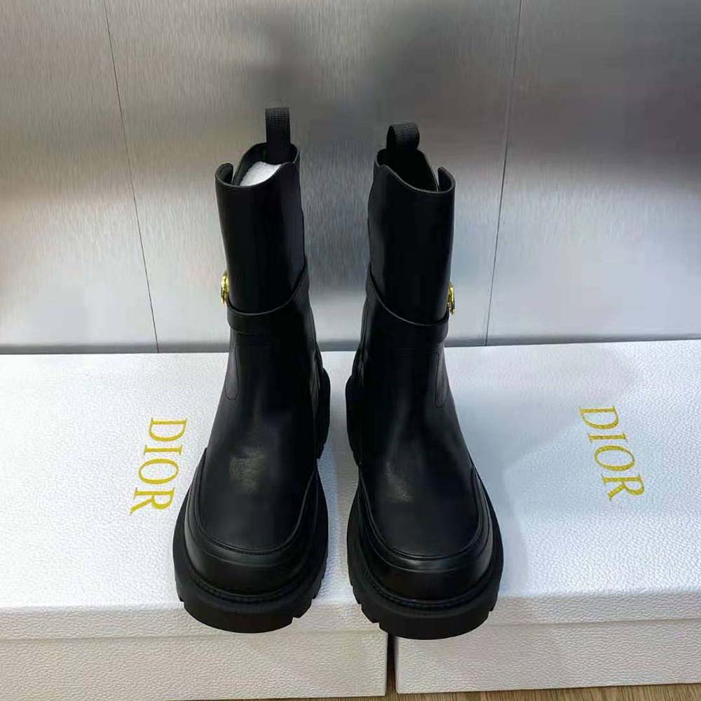 Close-up on signature embossed detail of Dior Women Empreinte Ankle Boot