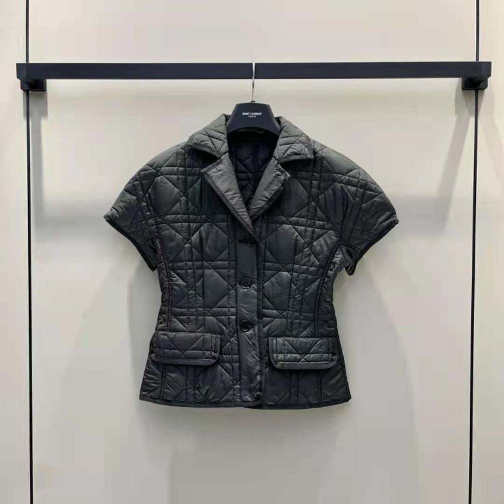 Close-up detail of puff sleeves and cloqué-effect fabric on Dior jacket