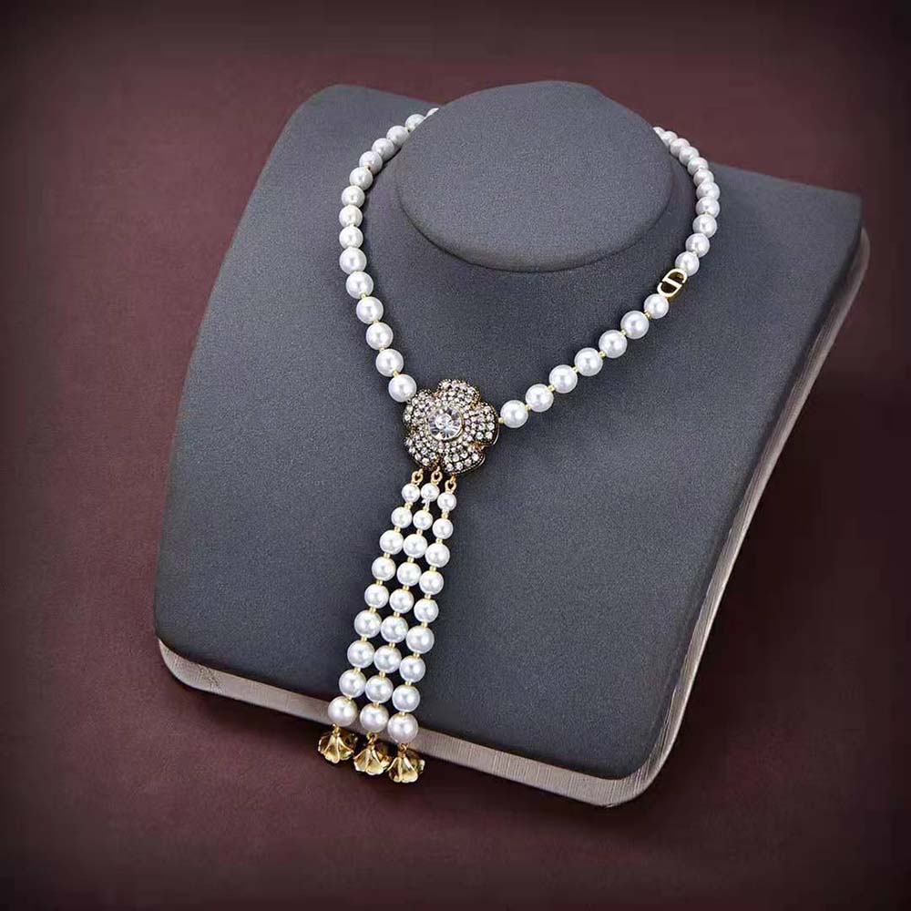 Close-up of white accents on Dior Women Jardin Enchanté Necklace