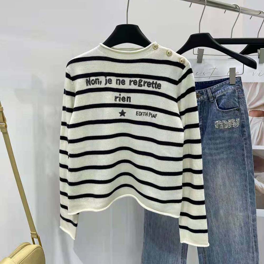 Close-up of Dior Breton stripe detail on cashmere knit sweater