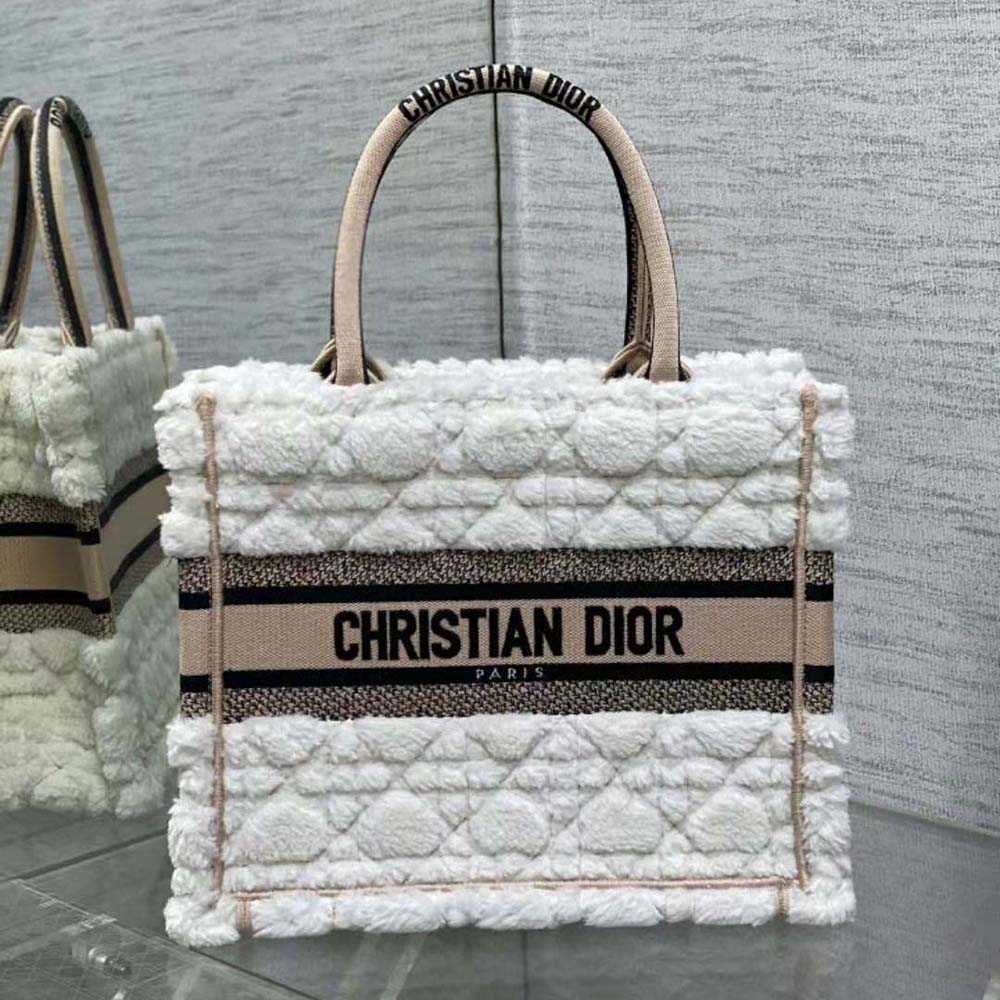 Close-up detail of white shearling and Cannage stitching on Dior tote