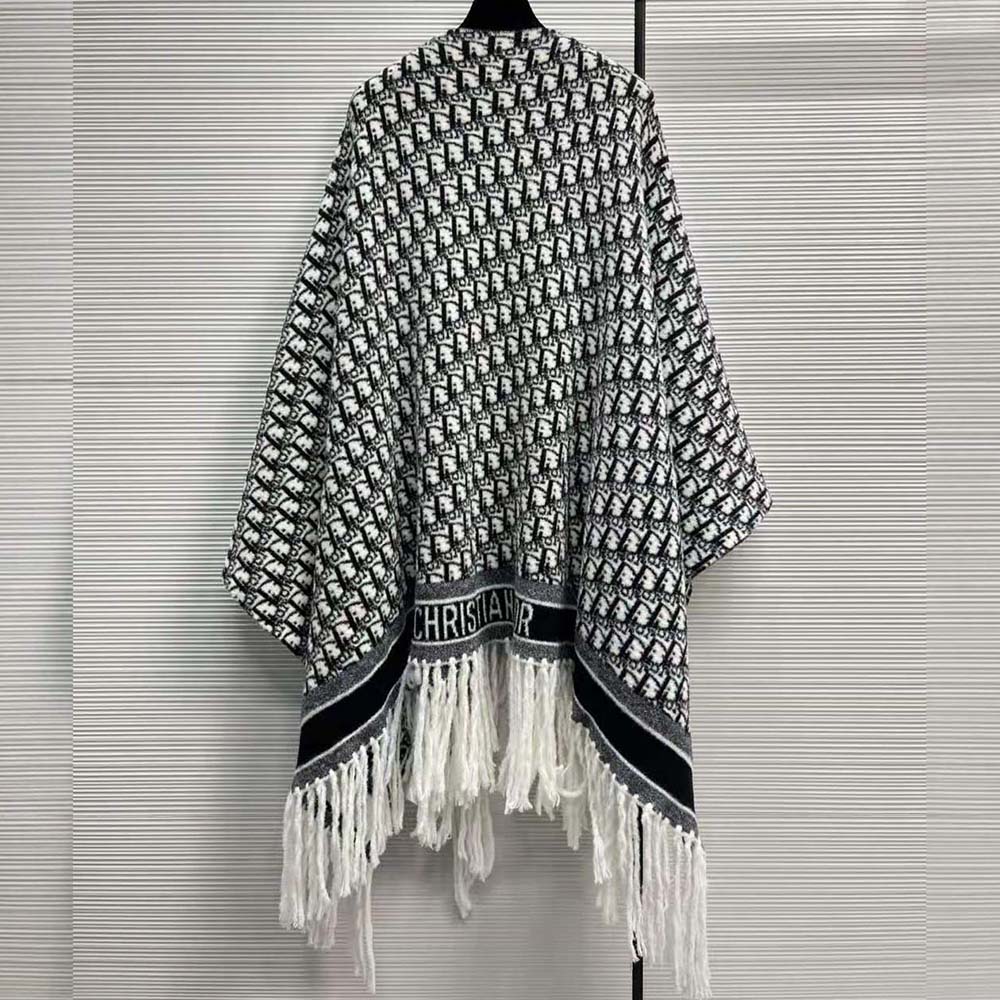 Side angle showing relaxed silhouette of Dior Women Oblique Poncho