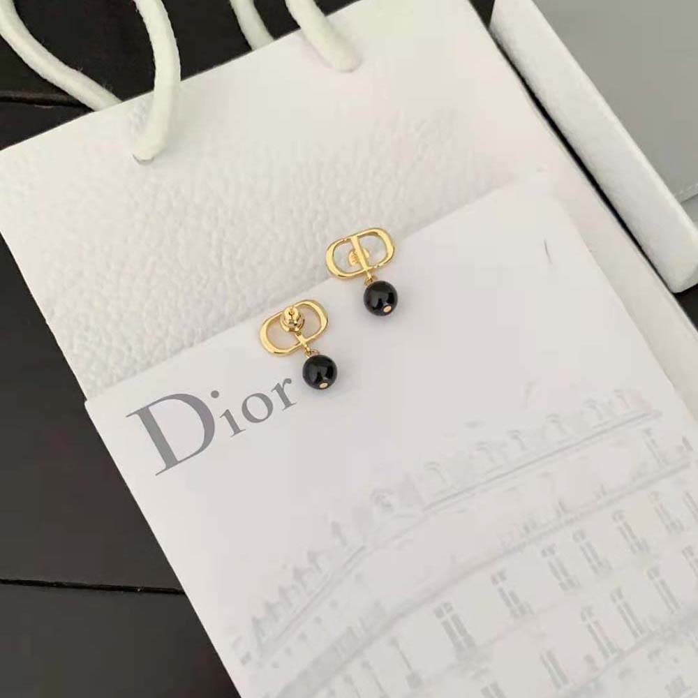 Side angle showing the ‘CD’ logo hardware detail on Dior Women Petit CD Earrings