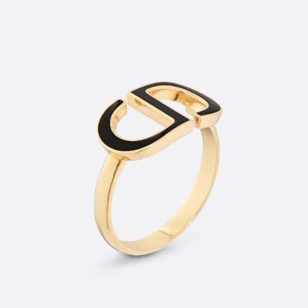 Close-up of Dior Women Petit CD Ring gold-finish and black lacquer detail
