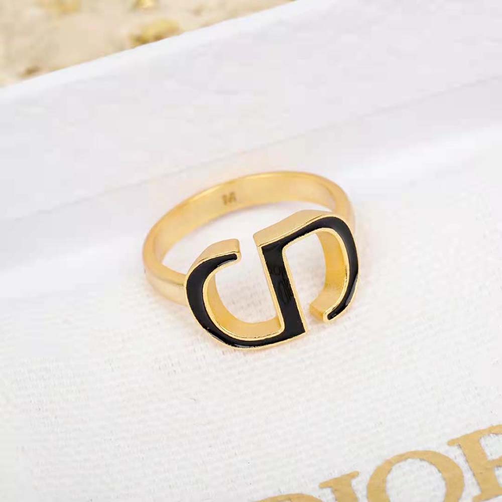Dior Women Petit CD Ring on model's finger with soft lighting