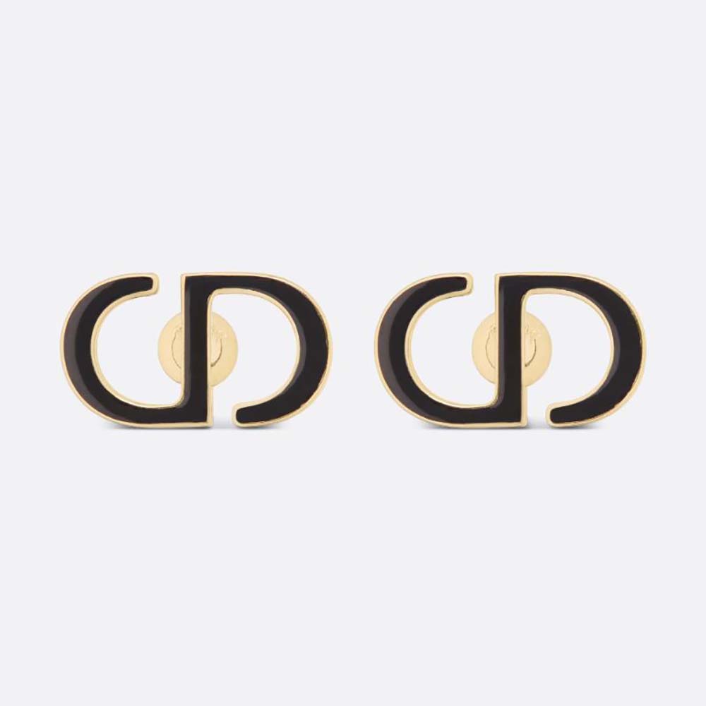 Close-up of Dior Women Petit CD Stud Earrings gold finish and black lacquer