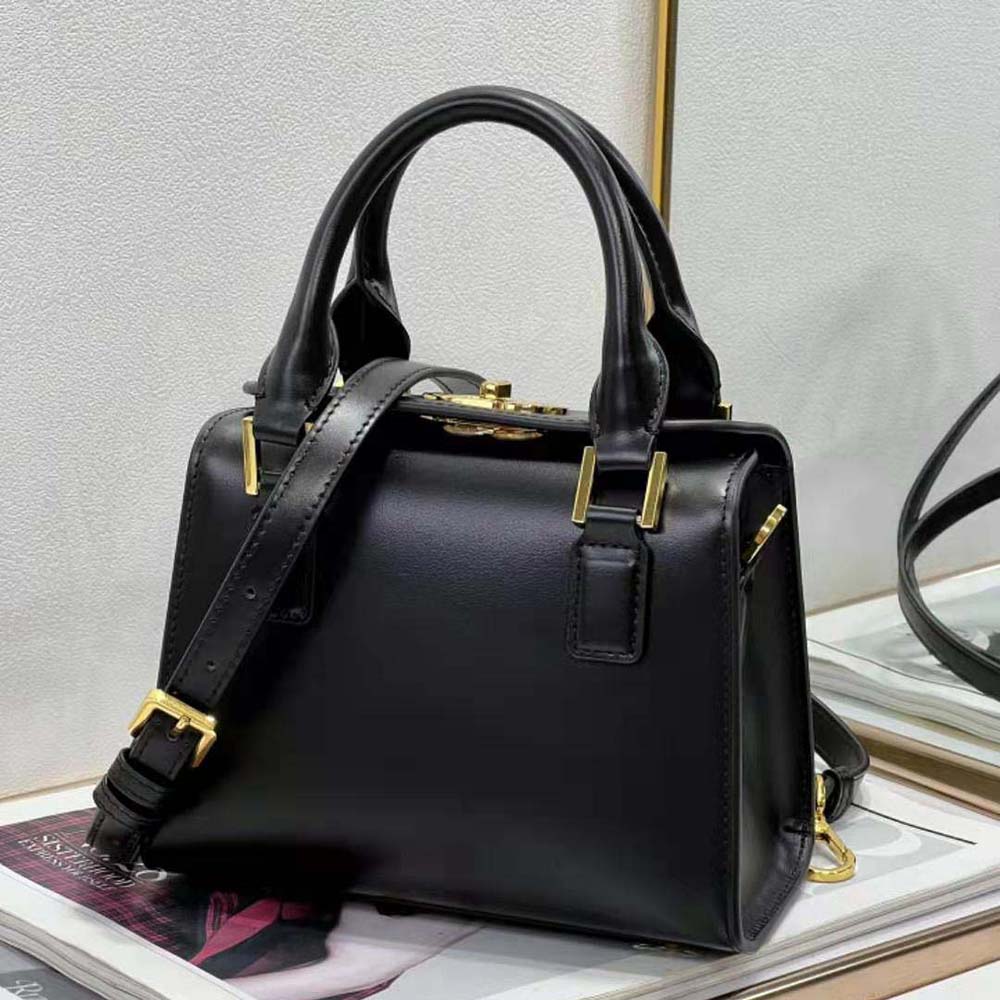 Side profile showing silhouette of Dior Women Small Boston Bag Black leather