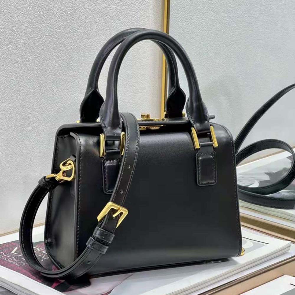 Close-up of silver hardware and zip closure on Dior Women Small Boston Bag