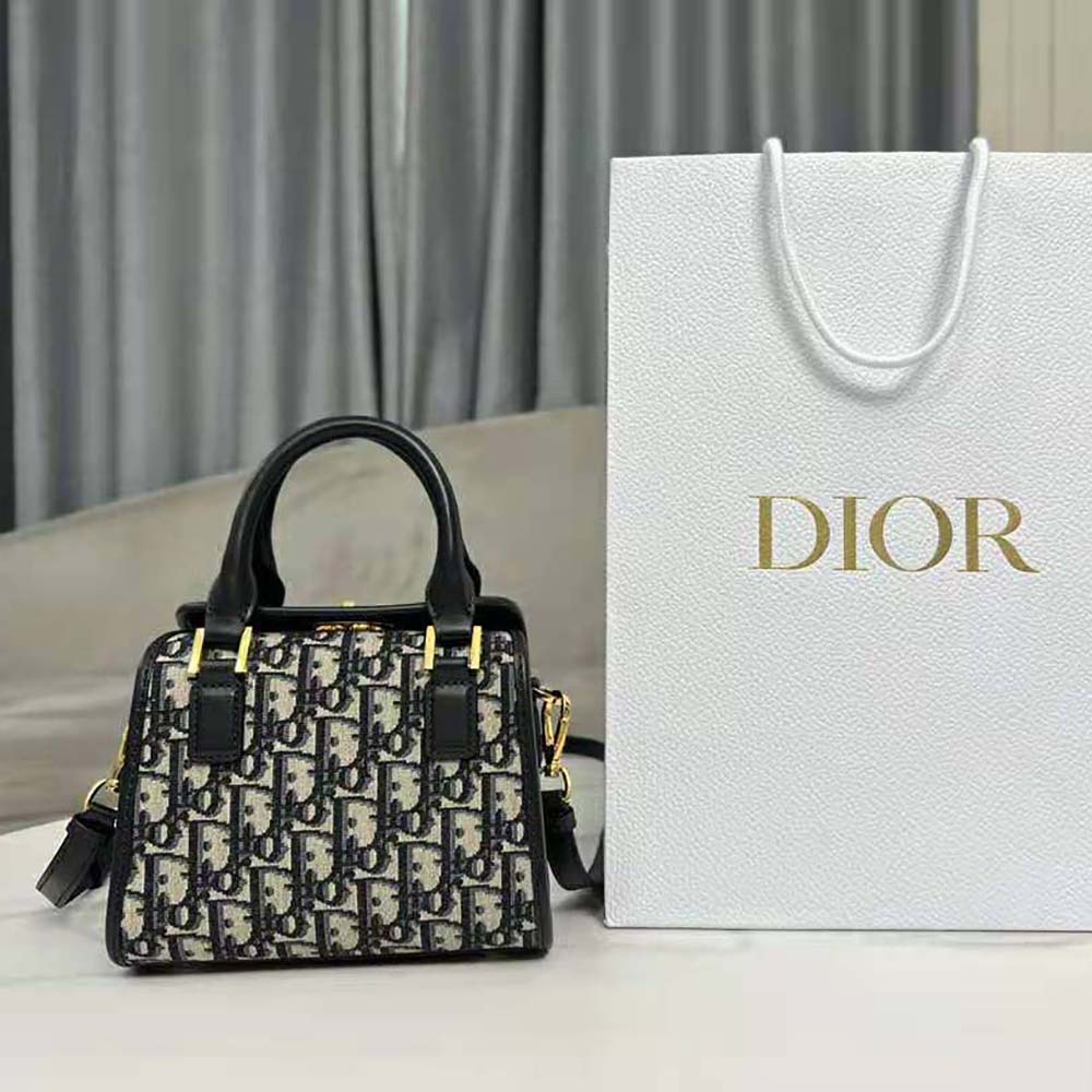Close-up of smooth calfskin and silver hardware on Dior Women Small Boston Bag