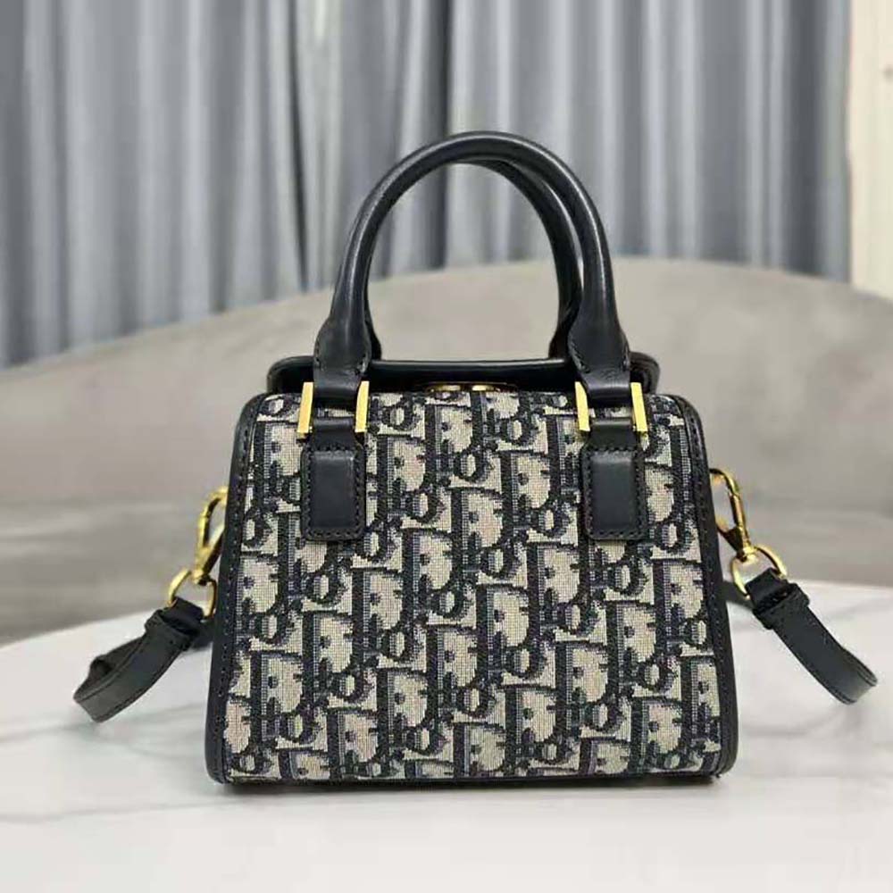 Side angle showing compact silhouette of Dior Women Small Boston Bag Blue