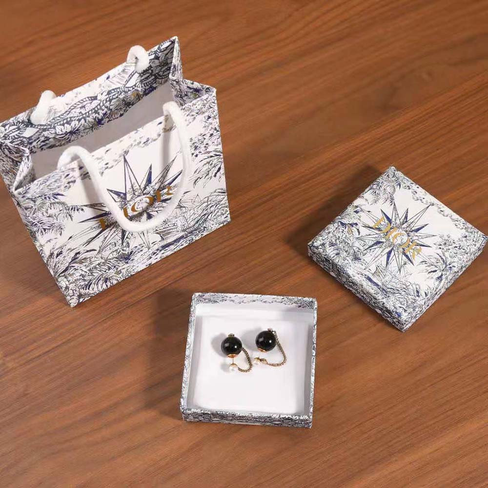 Side angle showing double-sided design of Dior Women Tribales Earrings