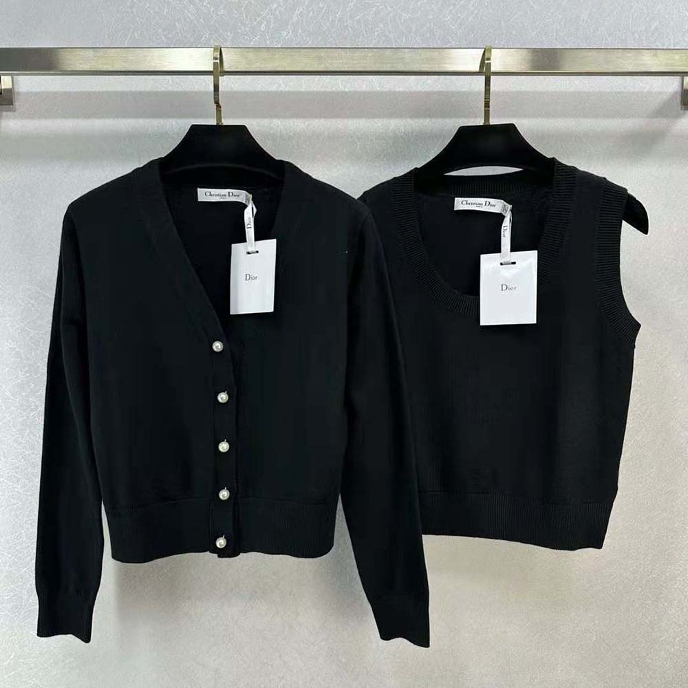 Close-up detail of signature Dior buttons on twin-set black cashmere knit