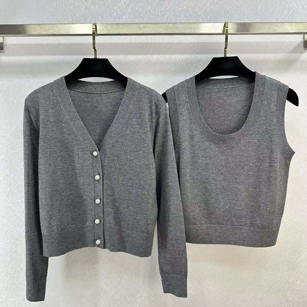 Close-up of Dior twin-set gray cashmere knit button detail