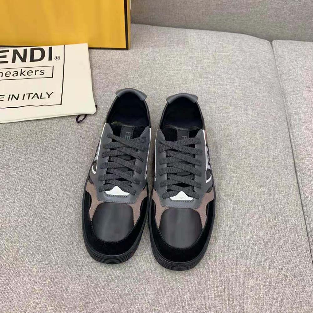 Close-up on black leather and embossed logo on Fendi Men Step sneakers