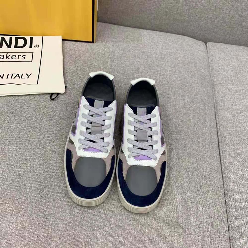 Close-up of lace closure and matte metal eyelets on Fendi Men Step Gray Low-tops