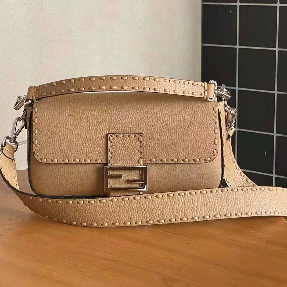 Close-up detail of beige Selleria leather and gold hardware on Fendi bag