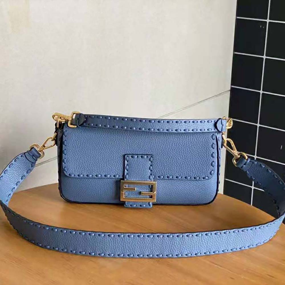 Close-up detail of blue leather and gold hardware on Fendi Women Baguette Bag