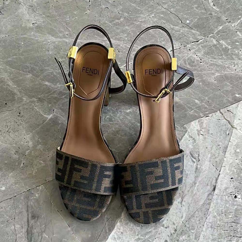 Close-up of gold buckle on Fendi Women Delfina Brown Fabric Sandals