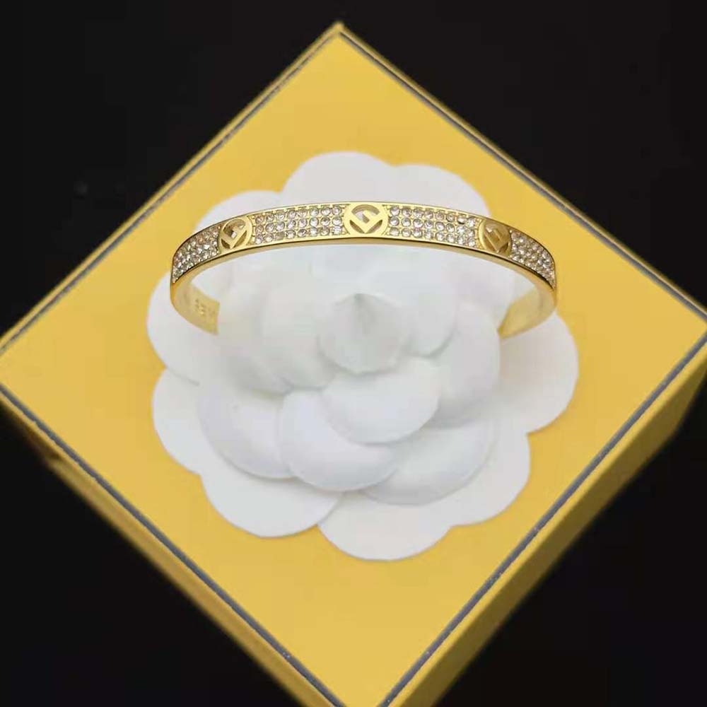 Side view of gold-coloured Fendi Women F Is Fendi Bracelet elegant silhouette