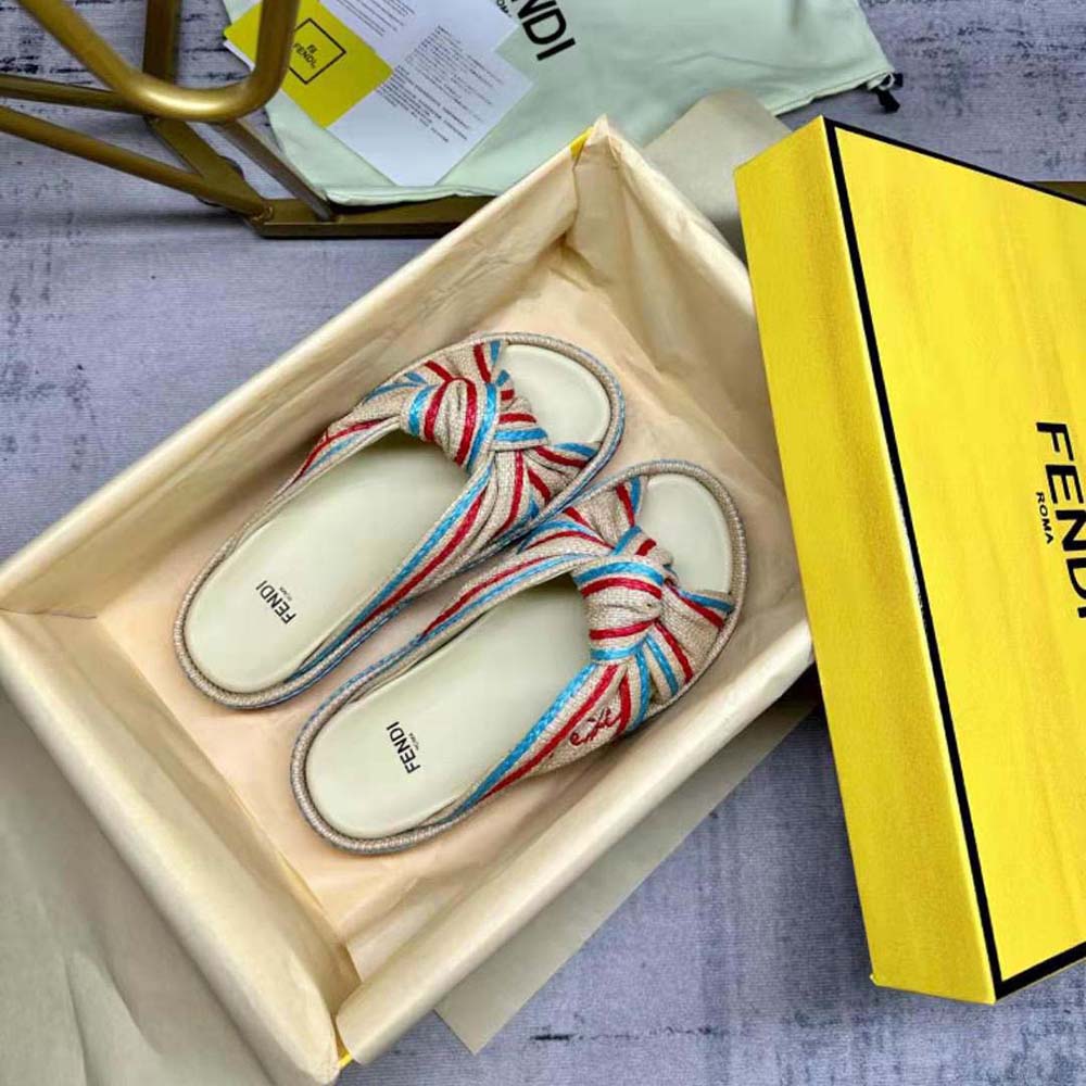 Close-up of Fendi Women Feel Pale Yellow Raffia Slides footbed and logo detail