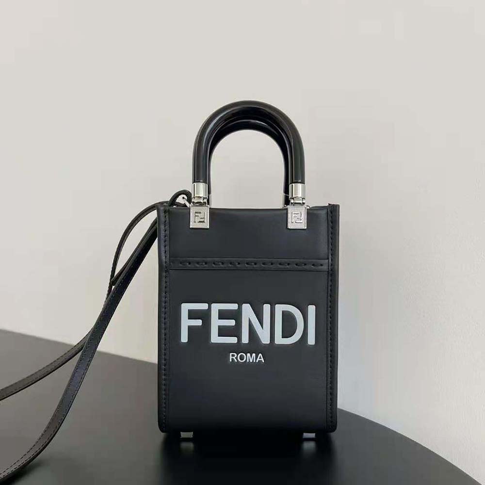 Close-up of gold-tone logo hardware on Fendi Women Mini Sunshine Shopper