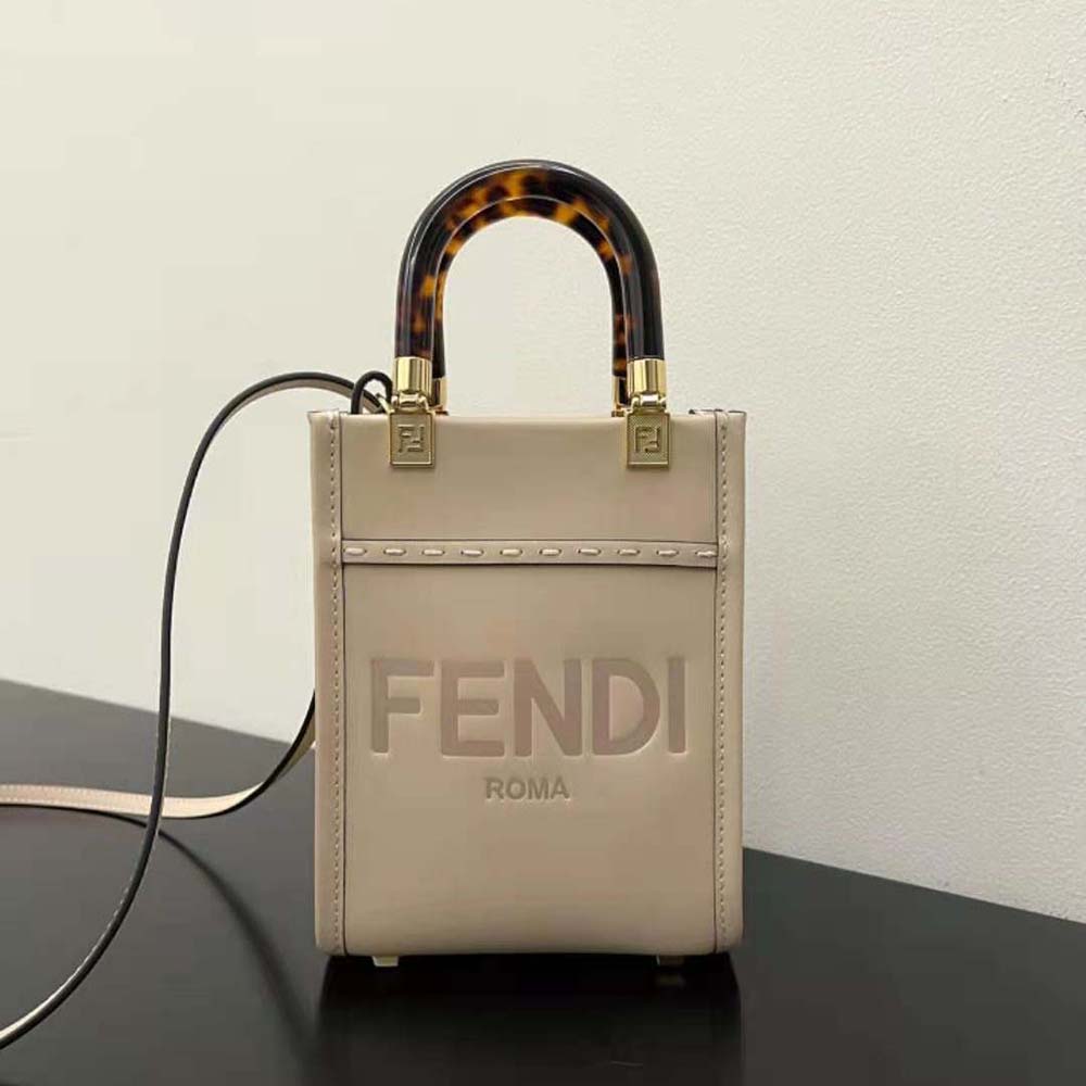 Close-up of gold hardware on Fendi Women Mini Sunshine Shopper mini-bag