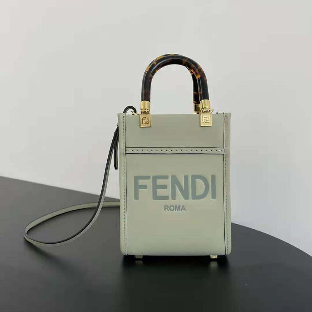 Close-up of gold-tone hardware on Fendi Women Mini Sunshine Shopper Light Green Leather Mini-bag