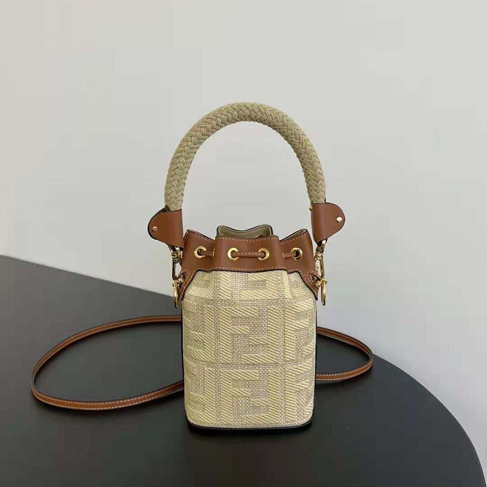 Side angle of Fendi Women Mon Tresor Natural Straw Mini-bag showing shoulder strap